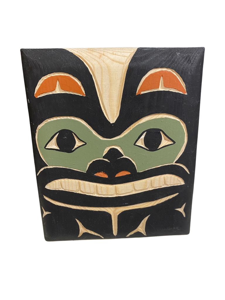 Hand carved and painted Northwest Totemic. Eagle Design using sustainable and upcycled wood and nontoxic paints. Colors include Black, Red, Green, and Natural Wood
